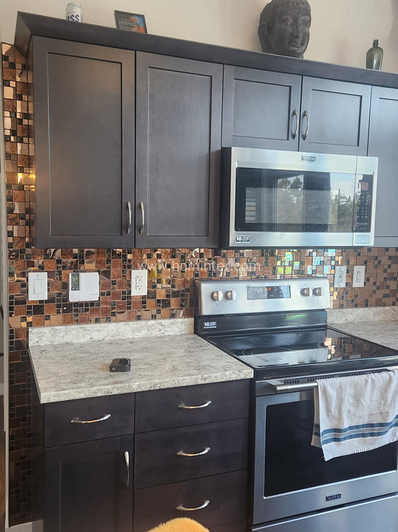 dark brown tile backsplash